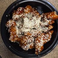 607. Sesame Chicken · Tender chicken lightly battered and deep fried then blended into special sauce topped with s...