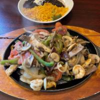 Fajitas · Choice of chicken, shrimp or steak in a sizzling skillet with onions, mushrooms, green and r...