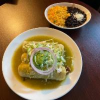 Enchiladas de Pollo en Salsa Verde · 3 soft tortillas filled with chicken, topped with Cotija cheese, sour cream, avocado, submer...