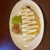 Camarones Quesadilla · Tortilla stuffed with sauteed shrimp, melted Mexican quesillo cheese, pico de gallo and sour...