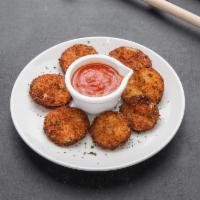 Zucchini Chips · Hand cut and breaded zucchini chips served with marinara.