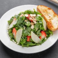 Arugula Salad · Organic wild arugula and baby spinach mix, strawberries, green apple slices, crumbled goat c...