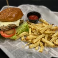 Turkey Becca Burger · Turkey patty, american cheese, lettuce, heirloom tomato, pickle, secret sauce on a brioche b...