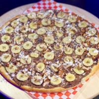 Nutella Pizza · For hazelnut chocolate spread lovers! Fell the sugar rush with Nutella spread with bananas o...