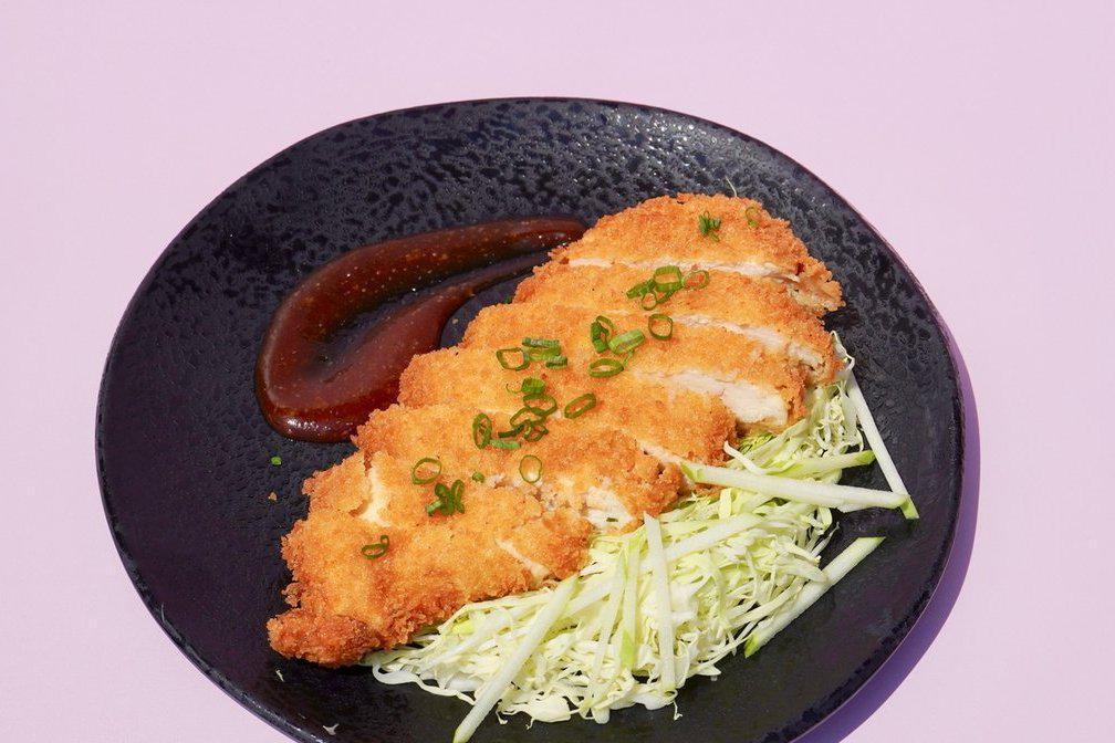 Chicken Katsu Plate · Chicken breast marinated overnight, breaded in panko, fried to a golden brown, and served with apple slaw and miso butter tonkatsu sauce.