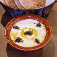 Labneh · Our signature yogurt blended with garlic and mint.