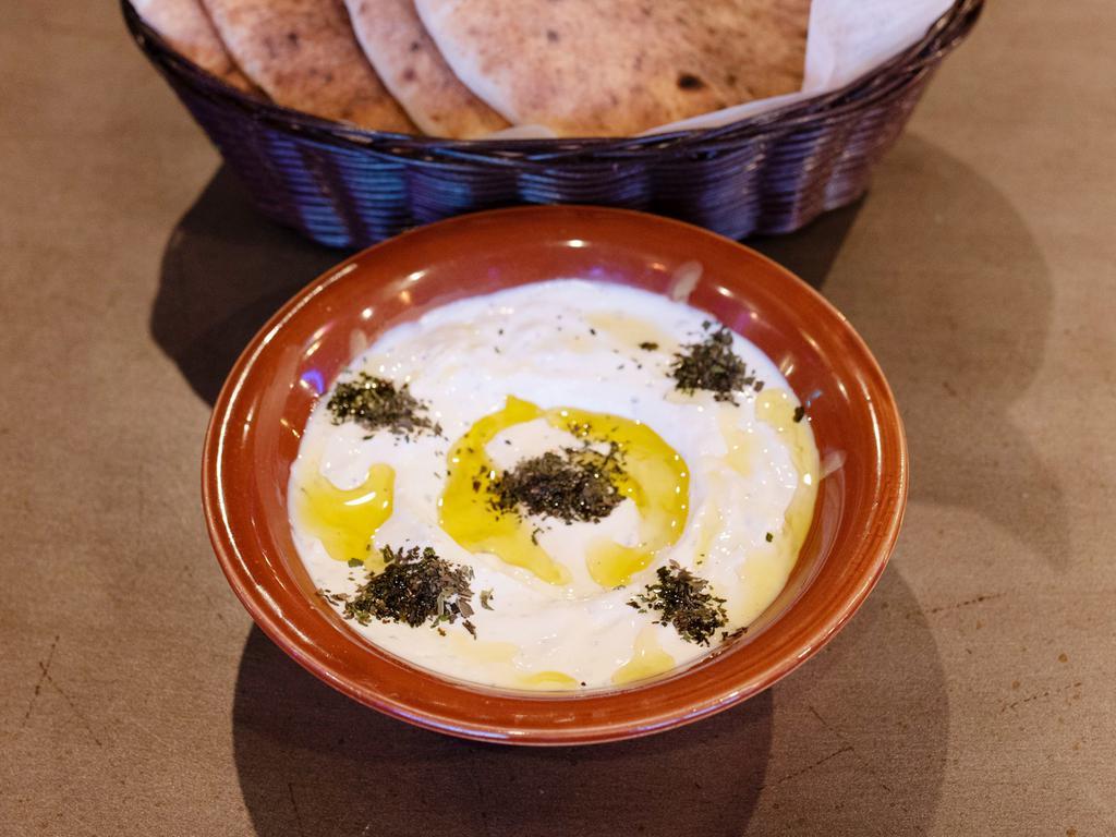 Labneh · Our signature yogurt blended with garlic and mint.