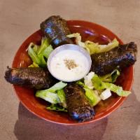 Grape Leaves · Homemade stuffed grape leaves with fresh vegetables, mint, rice and our signature seasoning....