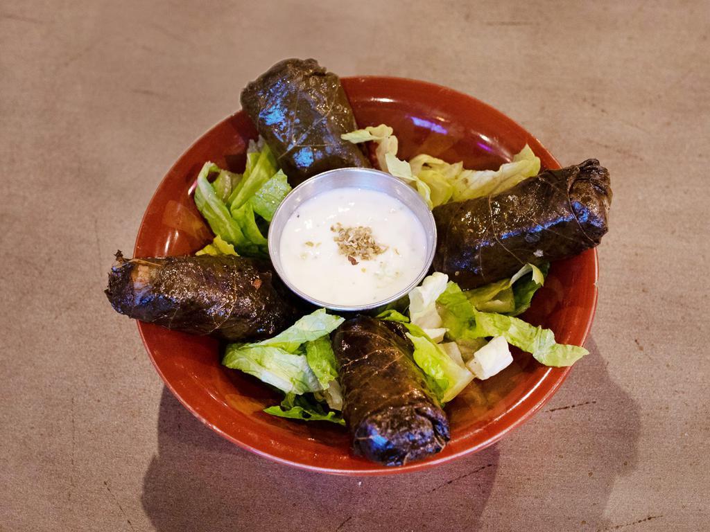 Grape Leaves · Homemade stuffed grape leaves with fresh vegetables, mint, rice and our signature seasoning. Spicy.