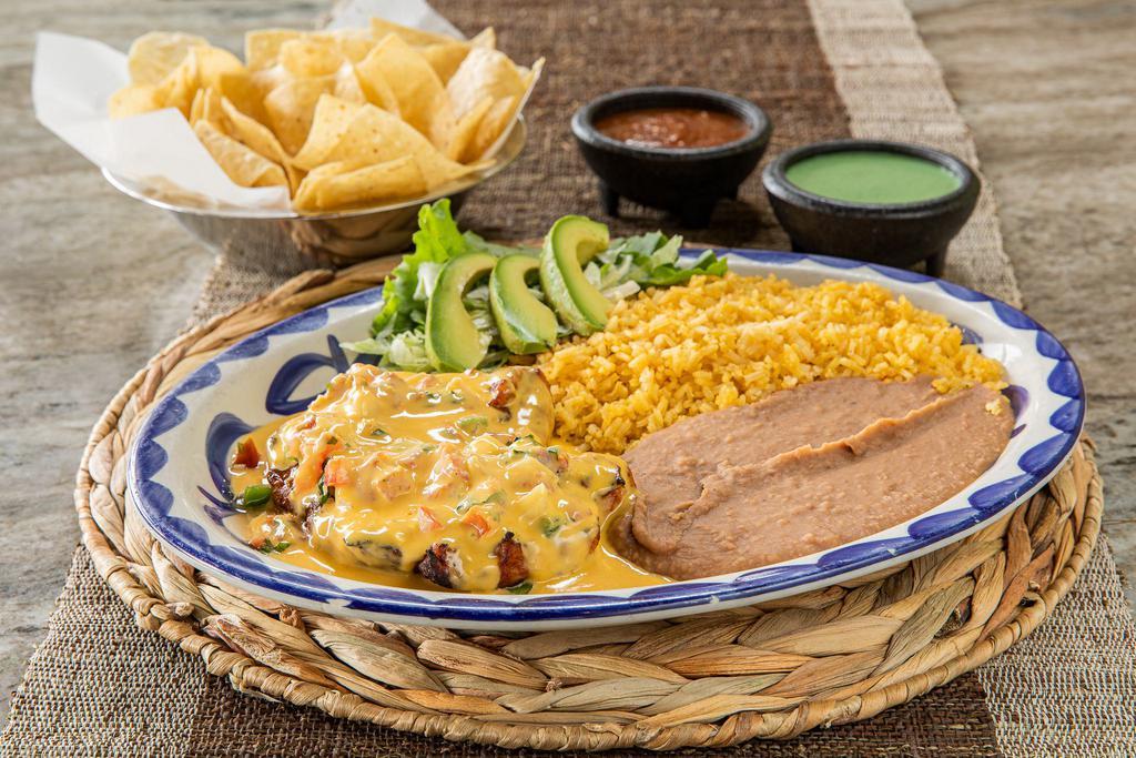 Cancun Chicken · A chargrilled chicken breast topped with pico de gallo, and chili con queso. Served with a sliced avocado, and your choice of rice and beans.