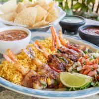 Shrimp Brochette · 6 pieces jumbo shrimp, stuffed with a slice of jalapeno and cheese, wrapped in bacon and gri...