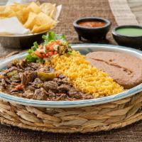 Carne Guisada Specialty · Braised short rib simmered with tomatoes, bell peppers, onions, garlic and Mexican spices in...