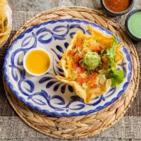 Taco Salad · A large crispy flour tortilla filled with taco meat or shredded chicken, crisp lettuce, toma...