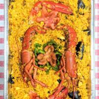 Paella Marinada · Full. Mixed yellow rice with seafood. Served with 2 sides.