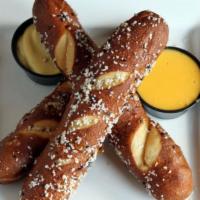 Bavarian Pretzels · 3 served with Gulden's mustard, gourmet mustard and cheese dipping sauce.