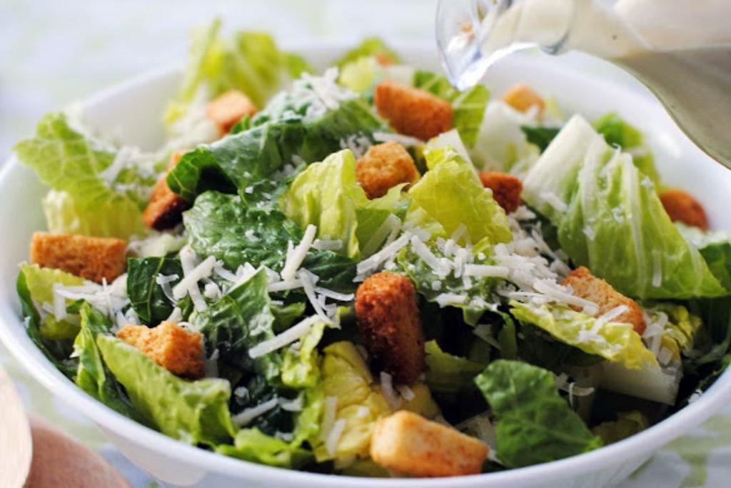 Chicken Caesar Salad · Romaine lettuce with grilled chicken, croutons, Parmesan cheese and side of Caesar dressing.