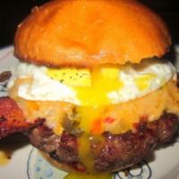Over Easy Burger with French Fries · Fried egg, bacon and cheddar cheese. Please specify temperature.