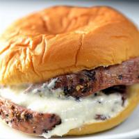 Filet Mignon Sliders · 3 pieces. Filet mignon sliders cooked medium rare topped with melted Gorgonzola cheese and p...