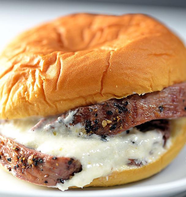 Filet Mignon Sliders · 3 pieces. Filet mignon sliders cooked medium rare topped with melted Gorgonzola cheese and pickled onions.