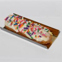 Eclair - Birthday Cake · Birthday cake flavored pastry cream with vanilla glaze and rainbow sprinkles