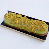 Eclair - Pistachio · Pistachio pastry cream with pistachio glaze topped in gold pistachios.