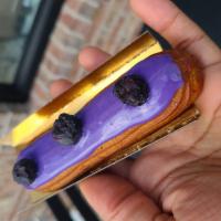 Eclair - Blueberry · Blueberry pastry cream, blueberry glaze, topped with freeze-dried blueberries