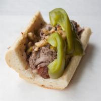 Combination Sandwich · Classic Italian beef with a piece of Italian sausage, dipped in aus jus, and served on Frenc...