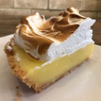 Lemon Meringue Pie · It starts with a vanilla wafer crust, a layer of fresh squeezed lemon filling that's expertl...
