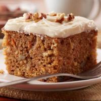 Carrot Cake · Sweet and moist cake, full of cut carrots and toasted nuts, and covered in cream cheese icing.