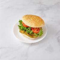 Veggie Burger Deluxe · Meatless burger. Served with lettuce, tomatoes and french fries.