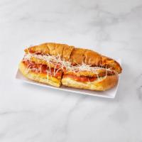 Chicken Parm Hero · A long sandwich on a roll. 