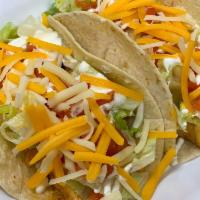 Chicken Tacos · Three Grilled Chicken Tacos with Lettuce, Monterey Jack & Cheddar cheese & Sour Cream served...