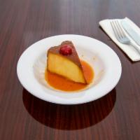 Flan · One slice of our famous flan topped with caramel sauce and fresh whipped cream.