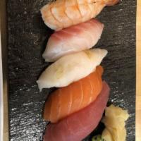 Sushi Appetizer · Five pieces of sushi chef choice.