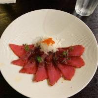 Pepper Tuna Tataki · Sliced Pepper tuna with ponzu sauce topped.