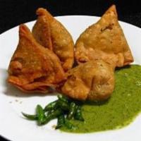 Vegetable Samosa · Turnover with mildly spiced potatoes.