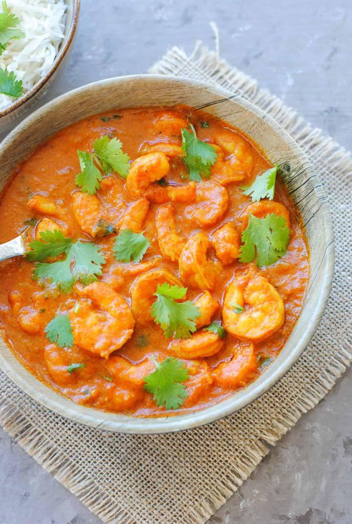 Shrimp Curry · Shrimp prepared in a mild sauce. Comes with basmati rice on the side.