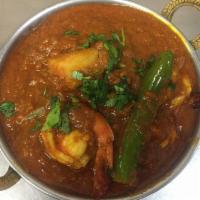 Shrimp Vindaloo · Shrimp prepared in a spicy gravy. Comes with basmati rice on the side.