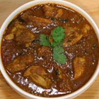Chicken Chetinadu · Boneless chicken cooked with ground spices and a touch of coconut. Spicy. Comes with basmati...