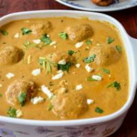 Malai Kofta · Homemade cottage cheese and vegetable dumplings simmered in a rich curry sauce. comes with b...