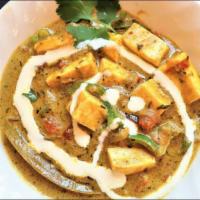 Haryali Paneer Makhni · Cubes of cottage cheese cooked in a creamy green sauce. Served with basmati rice on side.