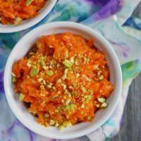 Gajar Halwa · Shredded carrots cooked in milk and served warm with nuts and raisins.
