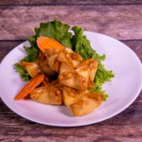 112. Crab Rangoon · 6 pieces. Fried wonton wrapper filled with crab and cream cheese.
