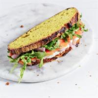 Smoked Salmon Sandwich · Gold smoked salmon with house-made fresh herbed lemon cream cheese, arugula and house-made p...