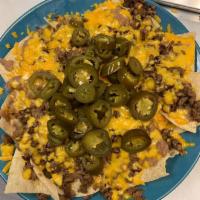 Meat Nachos · Served with guacamole, sour cream and jalapenos.