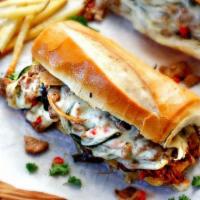 Philly Cheesesteak Sandwich · Mozzarella cheese, grilled onions, green pepper and red pepper.