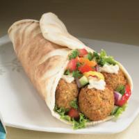 Falafel Sandwich  · Wrapped with pita bread, served with tomatoes, lettuce and pickles.