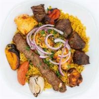 Mixed Grill Combo · 2 skewers. Served with 2 sides of your choice (rice, hummus, salad or fries).