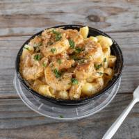 Creamy Shrimp Mac · American cheese mac, topped with our blackened
shrimp, white garlic sauce and sprinkled with...