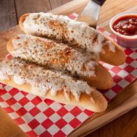 Cheesy Bread Sticks · It's Cheese That'll Make You Say Please! Our Cheesy Bread Sticks are topped with House Dredg...